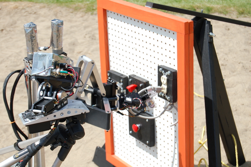 Inserting an electrical plug with the arm.